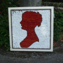 Jane Austen in the design of an old 'Penny Red' postage stamp.