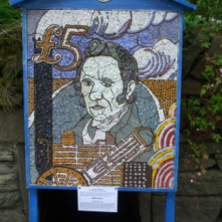 George Stephenson, inventor of the famous Rocket steam locomotive. The well can be seen at the bottom of the well dressing board.